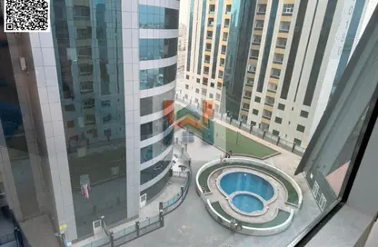 شقة - غرفة نوم - 2 حمامات للايجار في أورينت تاور 1 - أورينت تاور - البستان - عجمان