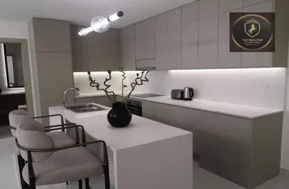صورة لـ مطبخ شقة - 3 غرف نوم - 4 حمامات للبيع في إكويتي أركيد - الفرجان - دبي ، صورة رقم 1