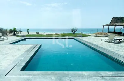 Pool image for: Villa - 6 Bedrooms for sale in Beachfront Residences - Nurai Island - Abu Dhabi, Image 1