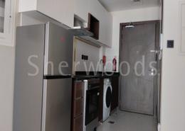 Kitchen image for: Studio - 1 bathroom for rent in Wavez Residence - Liwan - Dubai Land - Dubai, Image 1