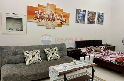 Living Room image for: Apartment - 1 Bathroom for sale in Elite Sports Residence 2 - Elite Sports Residence - Dubai Sports City - Dubai, Image 1