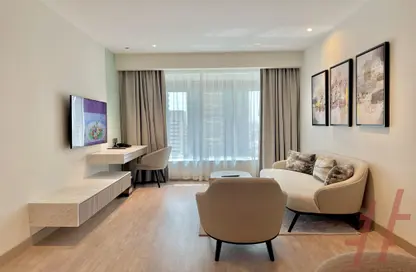 Living Room image for: Apartment - 1 Bedroom - 1 Bathroom for rent in Grand Stay Hotel - Sheikh Zayed Road - Dubai, Image 1