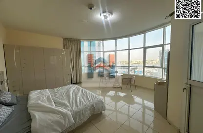 شقة - غرفة نوم - 2 حمامات للايجار في أورينت تاور 1 - أورينت تاور - البستان - عجمان