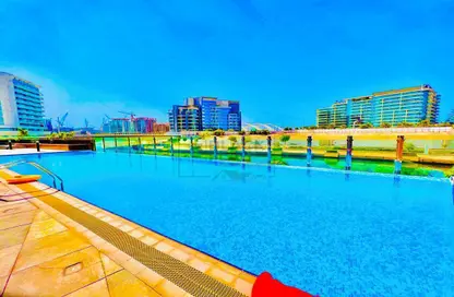Pool image for: Apartment - 1 Bedroom - 2 Bathrooms for rent in Azzam One Residence - Al Raha Beach - Abu Dhabi, Image 1