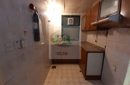 صورة لـ مطبخ شقة - غرفة نوم - 1 حمام للايجار في المشرف - أبوظبي ، صورة رقم 1