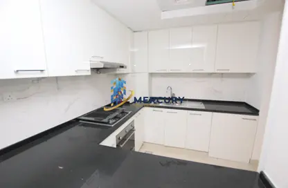 صورة لـ مطبخ شقة - غرفة نوم - 2 حمامات للايجار في مبني اوكسفورد - قرية الجميرا سركل - دبي ، صورة رقم 1