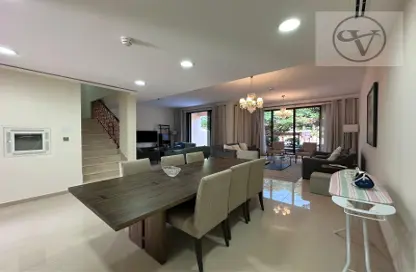 Living / Dining Room image for: Townhouse - 4 Bedrooms - 5 Bathrooms for rent in Jumeirah Islands Townhouses - Jumeirah Islands - Dubai, Image 1