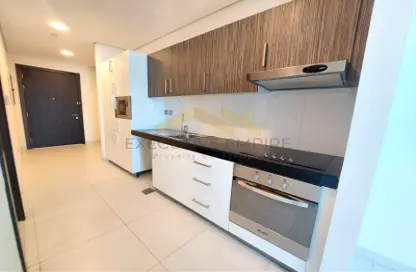 Kitchen image for: Apartment - 1 Bathroom for rent in Sorouh Tower - Danet Abu Dhabi - Abu Dhabi, Image 1