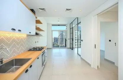 صورة لـ مطبخ شقة - غرفة نوم - 1 حمام للايجار في برج سوشيو - دبي هيلز استيت - دبي ، صورة رقم 1