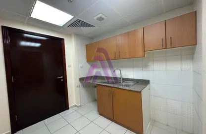 Kitchen image for: Apartment - 1 Bathroom for rent in K07 - Greece Cluster - International City - Dubai, Image 1