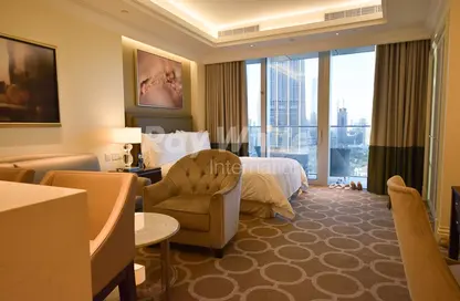 Living / Dining Room image for: Apartment - 1 Bathroom for rent in Kempinski BLVD - Downtown Dubai - Dubai, Image 1
