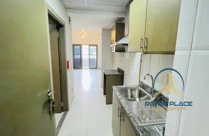 Kitchen image for: Apartment - 1 Bathroom for rent in City Compass Living - Dubai Investment Park - Dubai, Image 1
