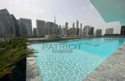 صورة لـ حوض سباحة شقة - 1 حمام للبيع في بن غاطي كانال - الخليج التجاري - دبي ، صورة رقم 1