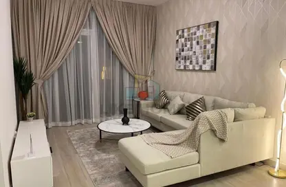 Living Room image for: Apartment - 1 Bedroom - 2 Bathrooms for rent in Bloom Heights - Jumeirah Village Circle - Dubai, Image 1