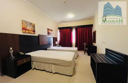 Room / Bedroom image for: Apartment - 2 Bedrooms - 2 Bathrooms for rent in Ivory Grand Hotel Apartments - Al Barsha 1 - Al Barsha - Dubai, Image 1