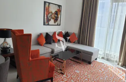Living Room image for: Apartment - 2 Bedrooms - 3 Bathrooms for sale in Golf Promenade 2B - Golf Promenade - DAMAC Hills - Dubai, Image 1