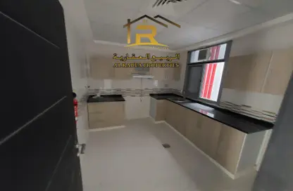 Kitchen image for: Apartment - 2 Bedrooms - 3 Bathrooms for rent in Al Rawda 2 - Al Rawda - Ajman, Image 1