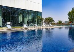Pool image for: Apartment - 1 bedroom - 2 bathrooms for rent in Rihan Heights - Grand Mosque District - Abu Dhabi, Image 1