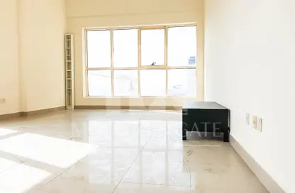 Empty Room image for: Apartment - 1 Bedroom - 2 Bathrooms for sale in Dana Tower - Jumeirah Village Circle - Dubai, Image 1