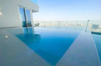 Pool image for: Apartment - 2 Bedrooms - 2 Bathrooms for sale in FIVE at Jumeirah Village Circle - Jumeirah Village Circle - Dubai, Image 1