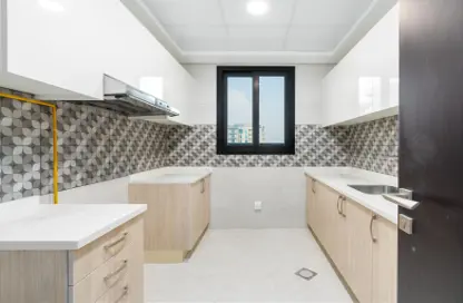 صورة لـ مطبخ شقة - 2 غرف نوم - 3 حمامات للبيع في براري هيلز ريزيدنس - مجان - دبي ، صورة رقم 1