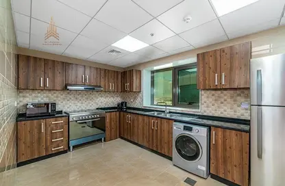 صورة لـ مطبخ شقة - 2 غرف نوم - 2 حمامات للبيع في برج كونكر - شارع الشيخ مكتوم بن راشد - عجمان ، صورة رقم 1