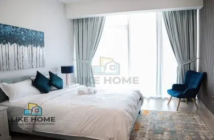 Room / Bedroom image for: Apartment - 1 Bathroom for rent in Bloom Towers - Jumeirah Village Circle - Dubai, Image 1