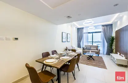 Living / Dining Room image for: Apartment - 1 Bedroom - 2 Bathrooms for sale in Central Park Tower - Jumeirah Village Circle - Dubai, Image 1
