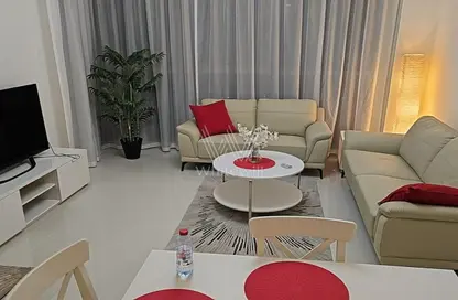 Living / Dining Room image for: Apartment - 1 Bedroom - 2 Bathrooms for sale in Golf Promenade 5A - Golf Promenade - DAMAC Hills - Dubai, Image 1