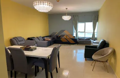 Living / Dining Room image for: Apartment - 2 Bedrooms - 2 Bathrooms for rent in Orient Towers - Al Bustan - Ajman, Image 1