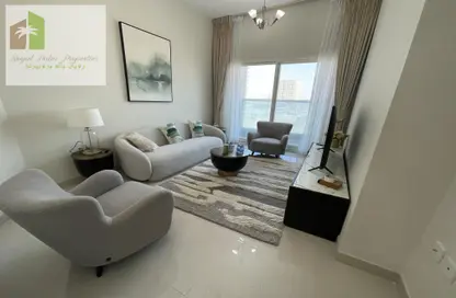 Living Room image for: Apartment - 2 Bedrooms - 2 Bathrooms for sale in Golf Tower - Emirates City - Ajman, Image 1