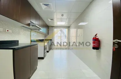 Kitchen image for: Apartment - 2 Bedrooms - 2 Bathrooms for rent in Tourist Club Area - Abu Dhabi, Image 1