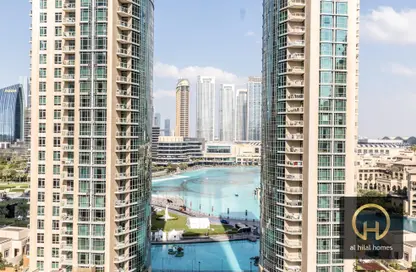 Outdoor Building image for: Apartment - 1 Bedroom - 2 Bathrooms for rent in 29 Burj Boulevard Tower 2 - 29 Burj Boulevard - Downtown Dubai - Dubai, Image 1