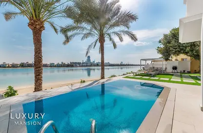 Villa - 5 Bedrooms - 7 Bathrooms for rent in Garden Homes Frond E - Garden Homes - Palm Jumeirah - Dubai