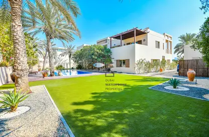Garden image for: Villa - 6 Bedrooms - 5 Bathrooms for sale in Sector E - Emirates Hills - Dubai, Image 1