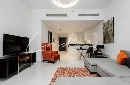 Living Room image for: Apartment - 1 Bedroom - 2 Bathrooms for rent in Golf Promenade 2B - Golf Promenade - DAMAC Hills - Dubai, Image 1
