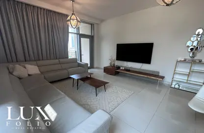 Living Room image for: Apartment - 1 Bedroom - 2 Bathrooms for sale in Boulevard Crescent 1 - BLVD Crescent - Downtown Dubai - Dubai, Image 1