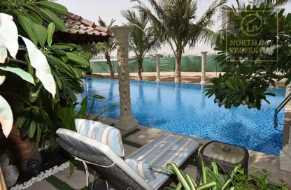Pool image for: Villa - 5 Bedrooms for rent in Al Hamra Village Villas - Al Hamra Village - Ras Al Khaimah, Image 1