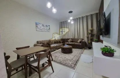 Living / Dining Room image for: Apartment - 1 Bedroom - 1 Bathroom for rent in Almond Tower - Garden City - Ajman, Image 1