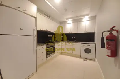 صورة لـ مطبخ شقة - غرفة نوم - 1 حمام للايجار في مجمع ار دي كي السكني - روضة أبو ظبي - أبوظبي ، صورة رقم 1