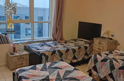 شقة - غرفة نوم - 2 حمامات للبيع في أورينت تاور 1 - أورينت تاور - البستان - عجمان