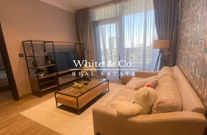 Living Room image for: Apartment - 1 Bedroom - 2 Bathrooms for rent in Chaimaa Avenue 2 - Chaimaa Avenue Residences - Jumeirah Village Circle - Dubai, Image 1