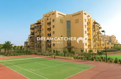 Outdoor Building image for: Apartment - 2 Bedrooms - 2 Bathrooms for sale in Al Thamam 57 - Al Thamam - Remraam - Dubai, Image 1