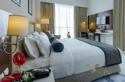 صورة لـ غرفة- غرفة النوم شقة - غرفة نوم - 1 حمام للايجار في تريبان للاجنحة الفندقية لفخر الدين - مدينة دبي الرياضية - دبي ، صورة رقم 1