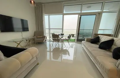 Living Room image for: Apartment - 1 Bedroom - 2 Bathrooms for rent in Carson B - Carson - DAMAC Hills - Dubai, Image 1