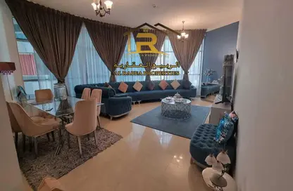 Living / Dining Room image for: Apartment - 3 Bedrooms - 4 Bathrooms for sale in Conquer Tower - Sheikh Maktoum Bin Rashid Street - Ajman, Image 1