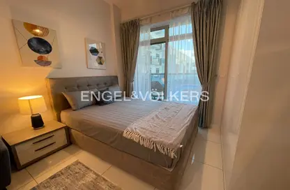 Room / Bedroom image for: Apartment - 1 Bathroom for rent in Plazzo Heights - Jumeirah Village Circle - Dubai, Image 1