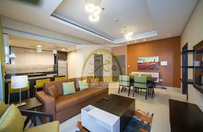 Living / Dining Room image for: Apartment - 1 Bedroom - 2 Bathrooms for rent in Al Jowhara Tower - Corniche Road - Abu Dhabi, Image 1