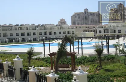Pool image for: Villa - 3 Bedrooms - 5 Bathrooms for sale in Bayti Townhouses - Al Hamra Village - Ras Al Khaimah, Image 1