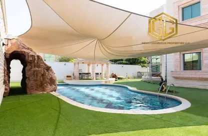 Pool image for: Villa - 5 Bedrooms - 6 Bathrooms for sale in Al Wuheida - Deira - Dubai, Image 1